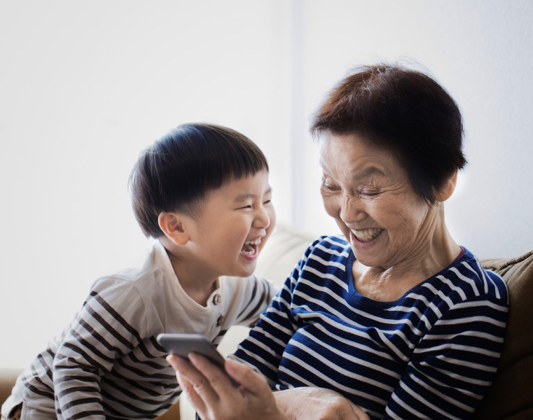 grandma and grandson smiling